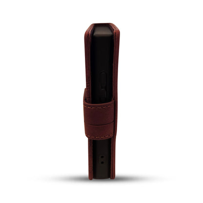 Brown leather case for sleek black electronic device with button and port details