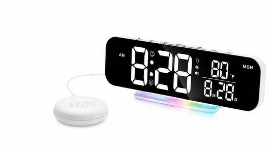Digital alarm clock with rainbow LED base, displaying time, temp, and day; sleek modern design
